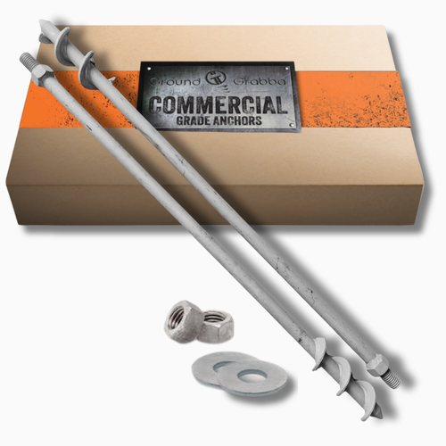 Metal anchors with washers on a cardboard box labeled 'Commercial Grade Anchors'.