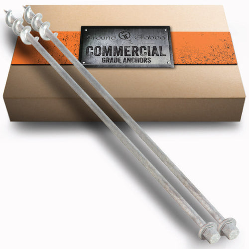 GroundGrabba Commercial Pro II 900mm screw-in ground anchors, pair of anchors displayed in front of branded Commercial Grade Anchors packaging box.